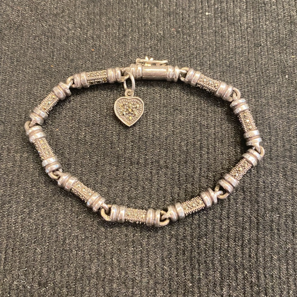 Silver and marcasite bracelet with heart chasm.